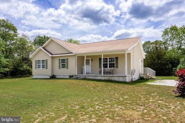 ranch-style home featuring a porch and a front lawn