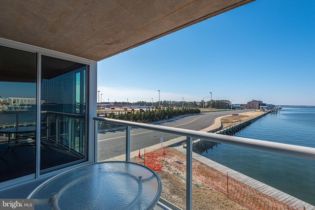 balcony featuring a water view