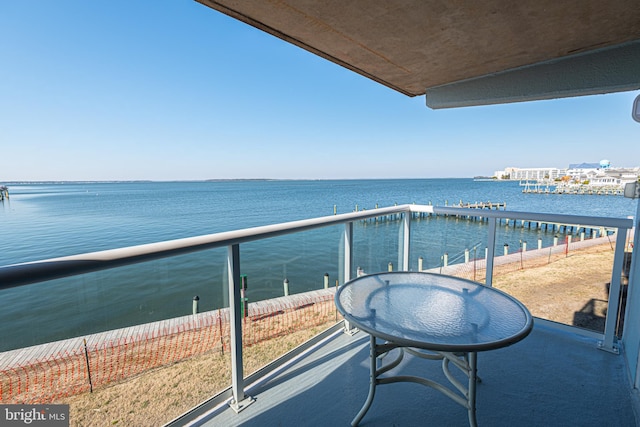 balcony featuring a water view