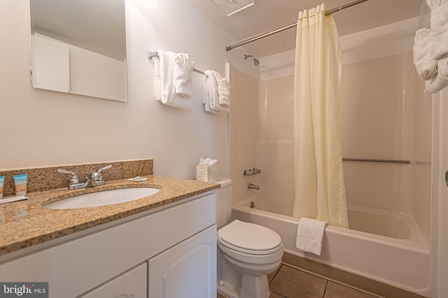 full bathroom featuring tile flooring, toilet, oversized vanity, and shower / tub combo with curtain