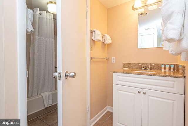 bathroom featuring tile flooring, shower / bathtub combination with curtain, and vanity