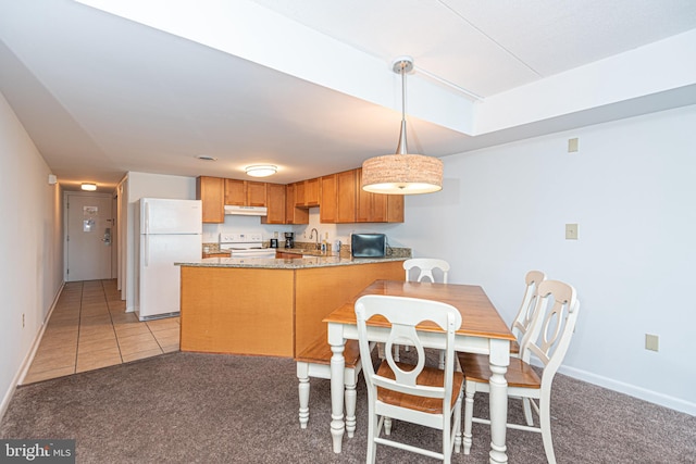 carpeted dining area featuring sink