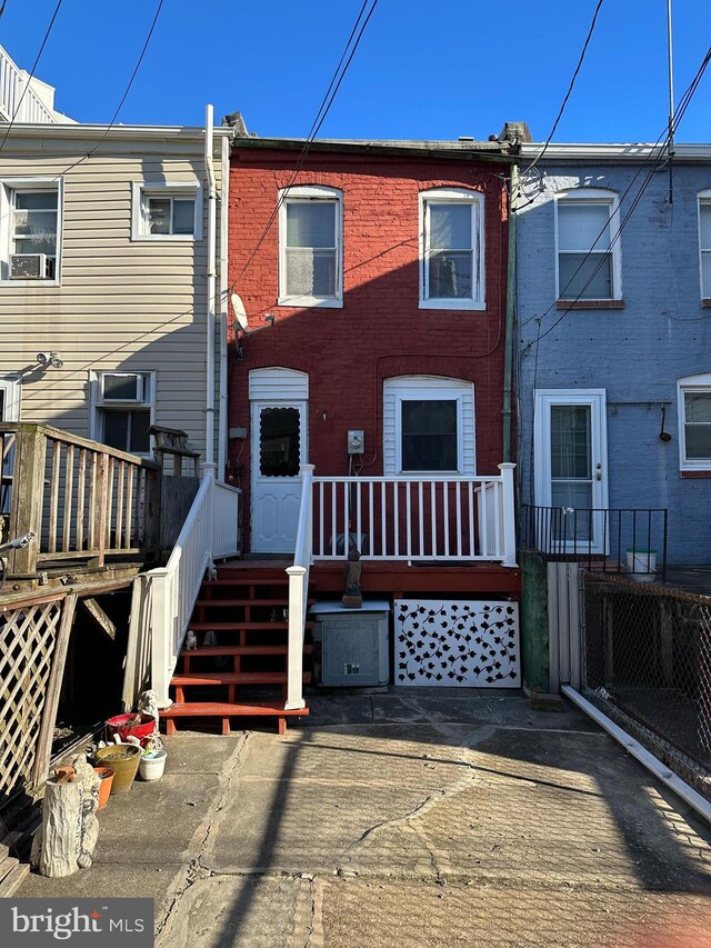 view of property featuring a wooden deck