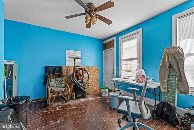 office area featuring ceiling fan, dark hardwood / wood-style floors, and a healthy amount of sunlight