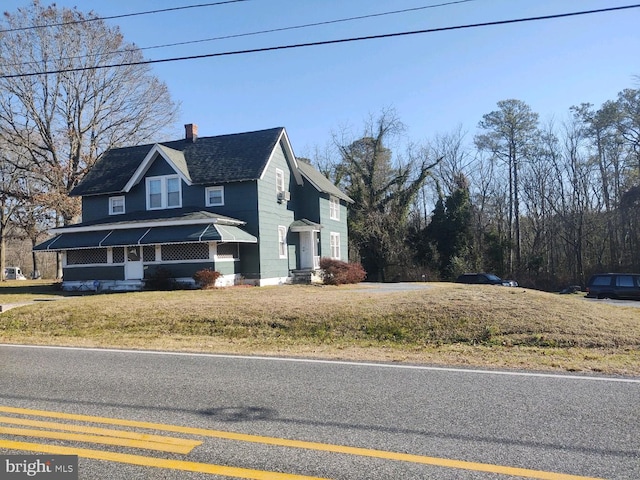 view of home's exterior with a yard