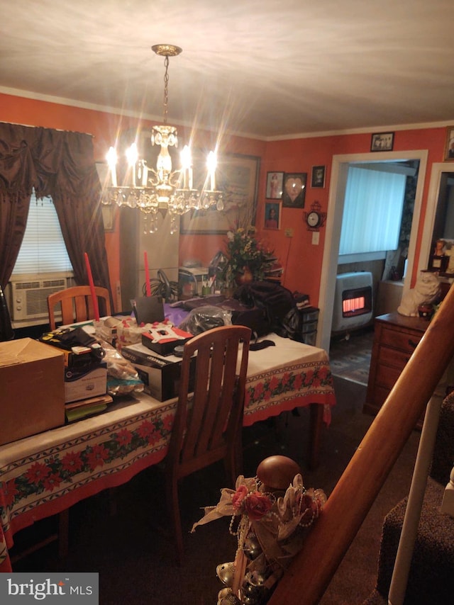 dining space with ornamental molding and an inviting chandelier