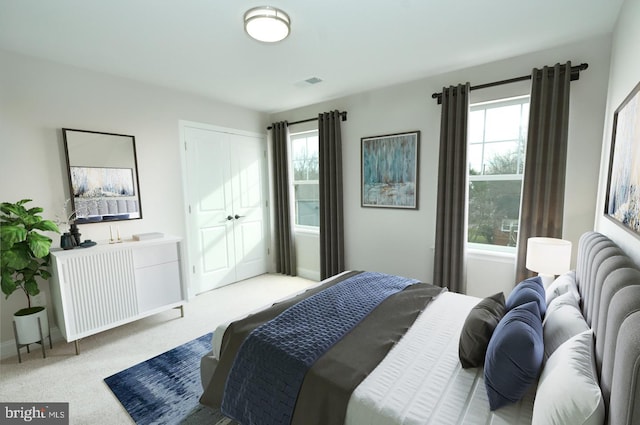 carpeted bedroom featuring multiple windows