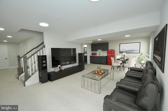 living room featuring light carpet