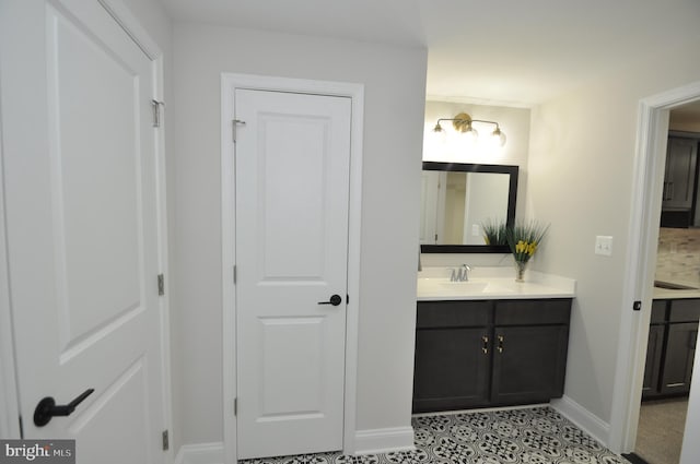 bathroom with tile patterned flooring and vanity