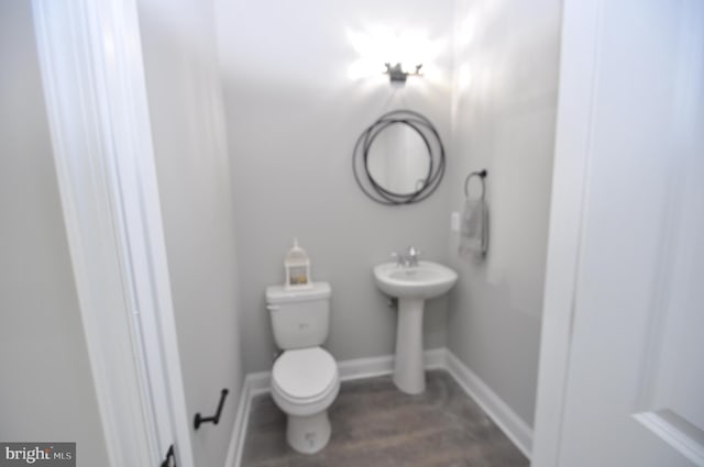 bathroom with toilet and sink