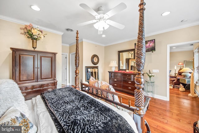 bedroom featuring light hardwood / wood-style flooring, ceiling fan, and crown molding