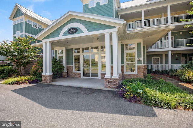 entrance to property with a balcony