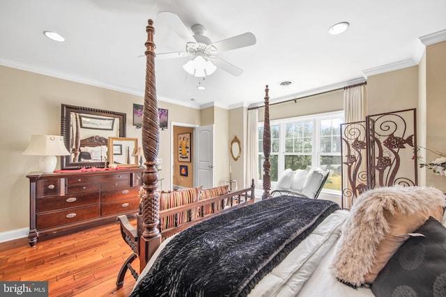 bedroom featuring ceiling fan, light wood-type flooring, and ornamental molding