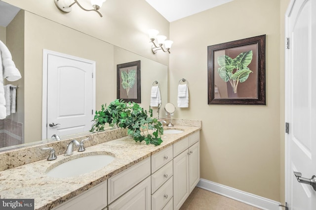 bathroom with vanity and tile patterned floors