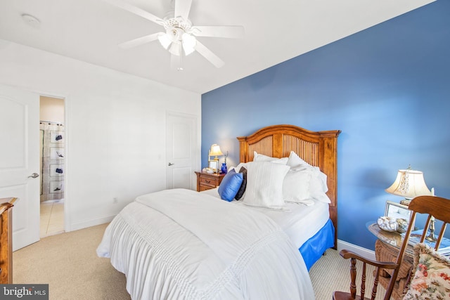 carpeted bedroom with ceiling fan and connected bathroom