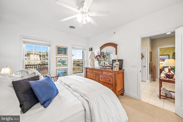 tiled bedroom with ceiling fan