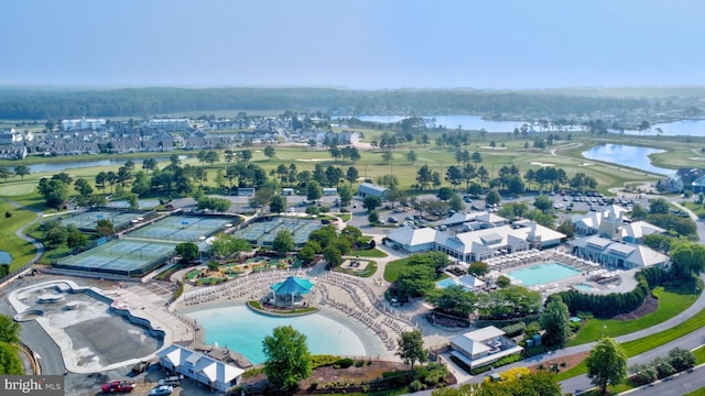 birds eye view of property with a water view