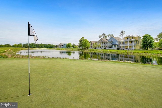 surrounding community featuring a yard and a water view