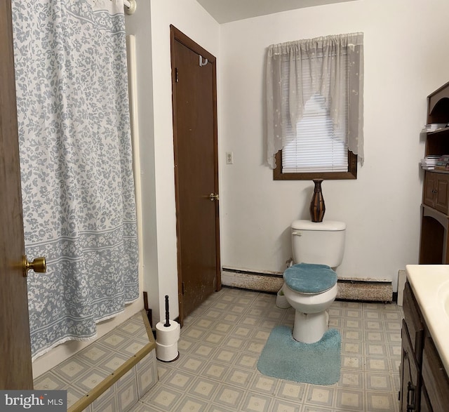 bathroom with vanity, tile flooring, and toilet