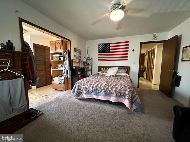 bedroom featuring light colored carpet and ceiling fan