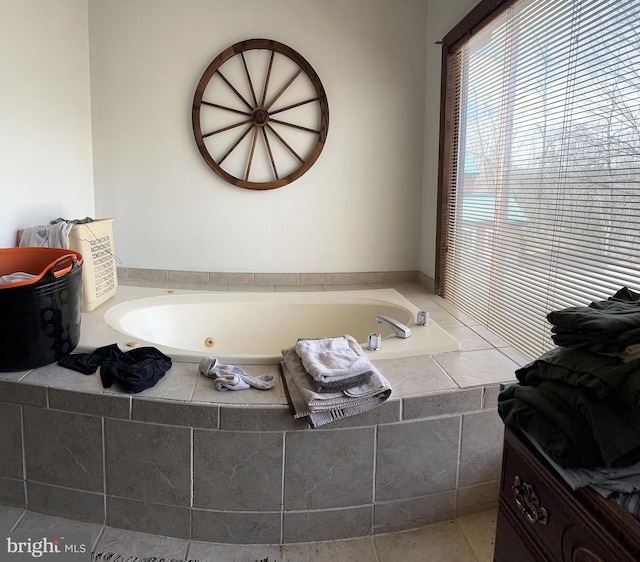 bathroom with tiled bath