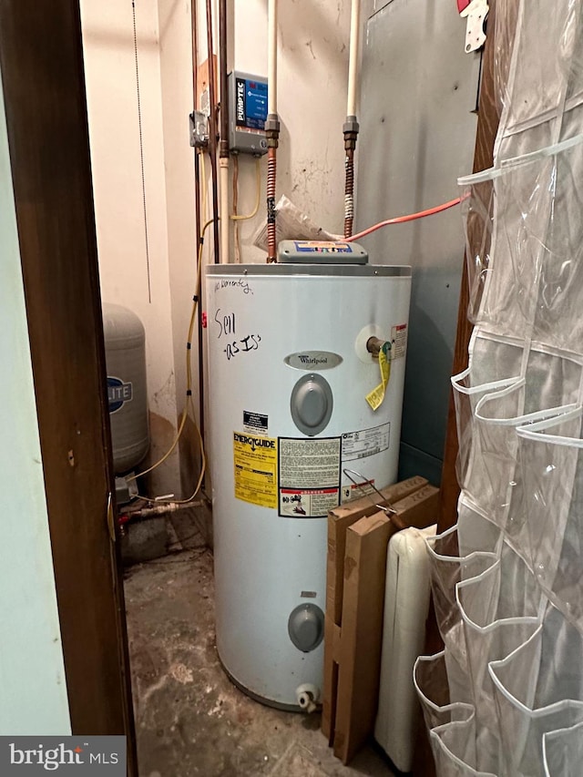 utility room with electric water heater