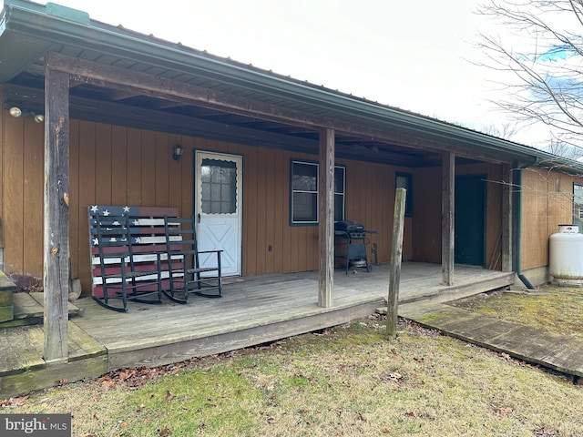 rear view of house with a wooden deck