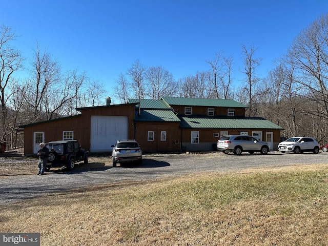 rear view of property with a lawn