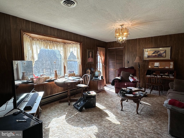 office area featuring an inviting chandelier, wooden walls, and carpet floors