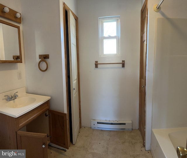 bathroom with tile floors, bathtub / shower combination, a baseboard radiator, and vanity with extensive cabinet space