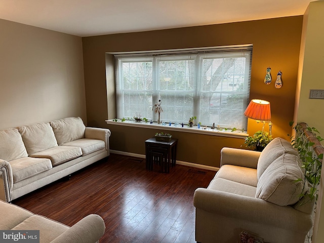 living room with dark hardwood / wood-style flooring