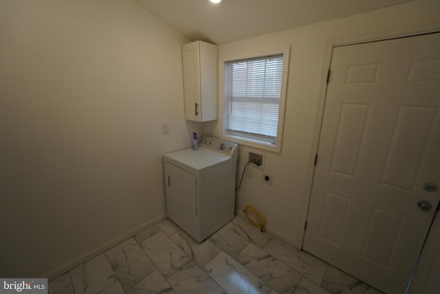 washroom featuring washer / clothes dryer, cabinets, and light tile floors