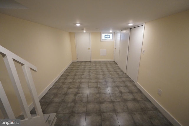 interior space with dark tile flooring