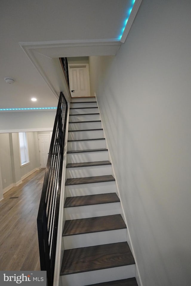 stairs with dark wood-type flooring