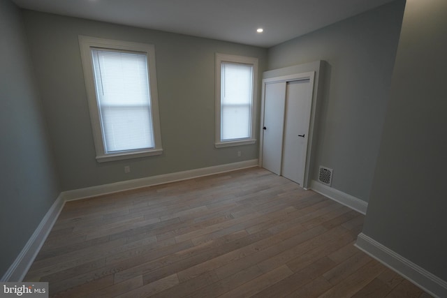 unfurnished room featuring dark hardwood / wood-style floors