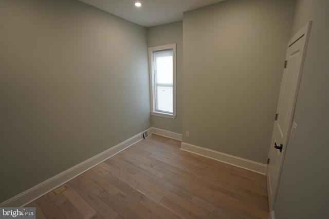 unfurnished room with light hardwood / wood-style flooring