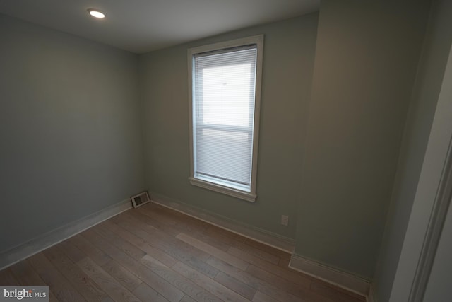 spare room featuring dark wood-type flooring