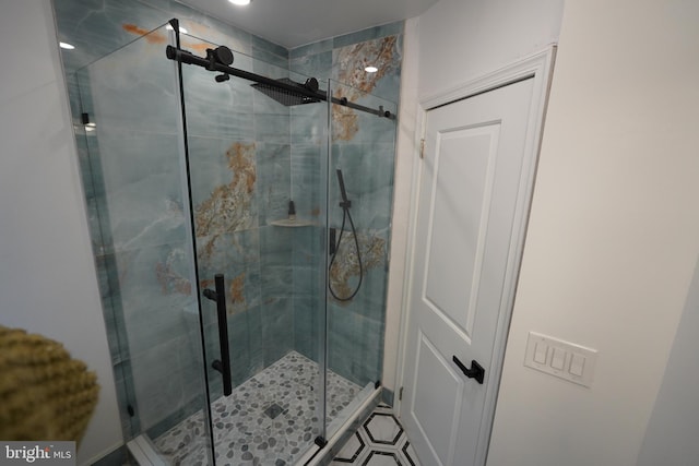 bathroom featuring walk in shower and tile floors