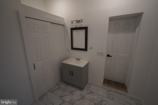 bathroom featuring tile floors and vanity