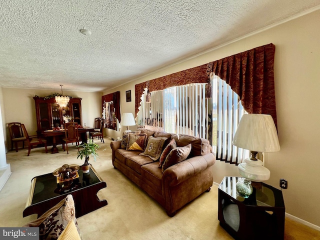 living room featuring light colored carpet, a chandelier, and a textured ceiling