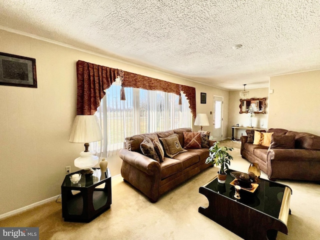 carpeted living room featuring an inviting chandelier and a textured ceiling