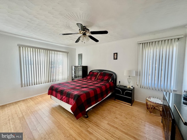 bedroom featuring ceiling fan and light wood-type flooring