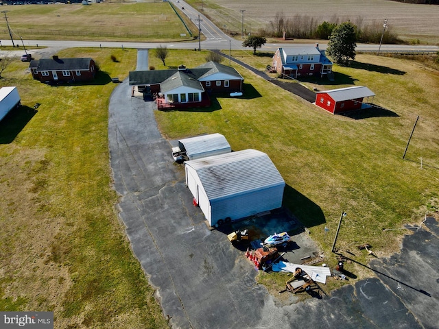 birds eye view of property with a rural view