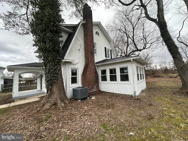 rear view of house with central AC