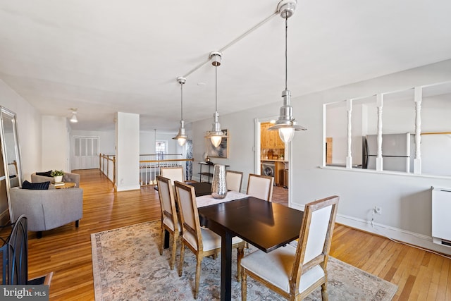 dining space featuring light hardwood / wood-style floors