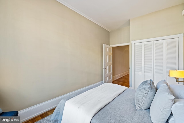 bedroom with a closet and dark hardwood / wood-style floors