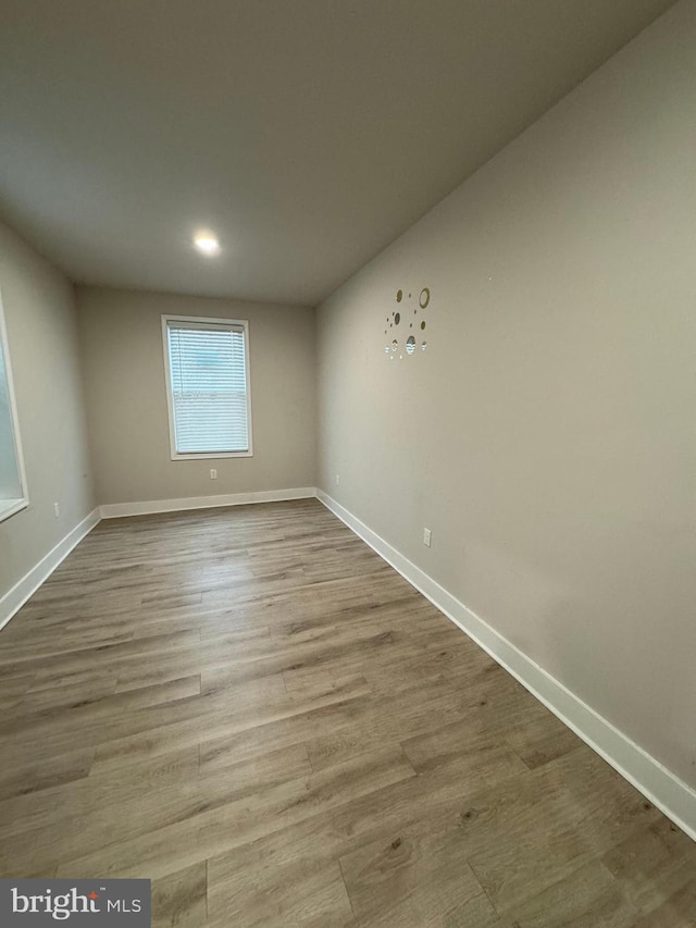 spare room featuring hardwood / wood-style flooring