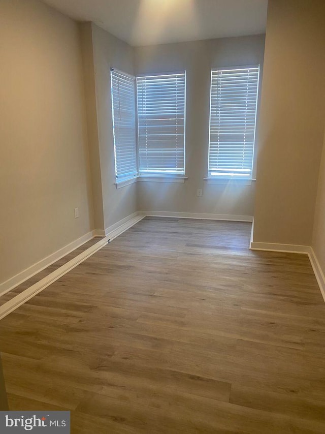 spare room featuring hardwood / wood-style floors