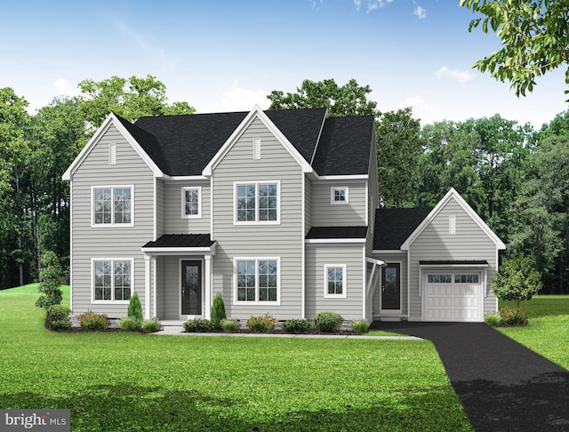 view of front of property featuring a front lawn and a garage