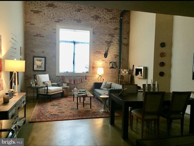 living room with brick wall and a wood stove